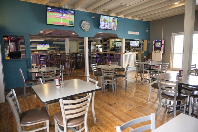 The two-week renovation included replacing the old panel walls, extending the bar, a fresh coat of paint, sanding and restoring the wooden floors and updating the seating. [Cindy Sharp/Correspondent]