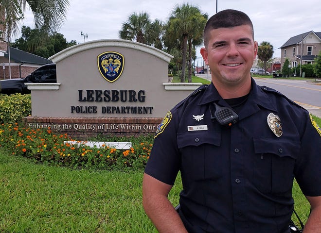 Leesburg Police Officer Alex Nell saved a woman's life Sunday by stopping her car from crushing her with just seconds to spare. [Payne Ray/Daily Commercial]