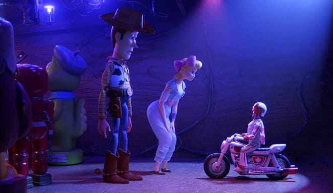 Woody and Bo Beep ask for some assistance from Duke Caboom. [Walt Disney Studios]