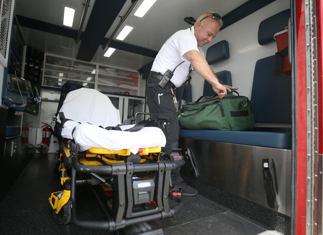 Lt. Paramedic Ken Knowles looks over equipment in an ambulance on Wednesday in Panama City. [PATTI BLAKE/THE NEWS HERALD]