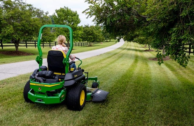 Lawn striping or other patterns are not actually mown in. Instead, sections of the lawn are mechanically flatten, creating an optical illusion. [John Deere]