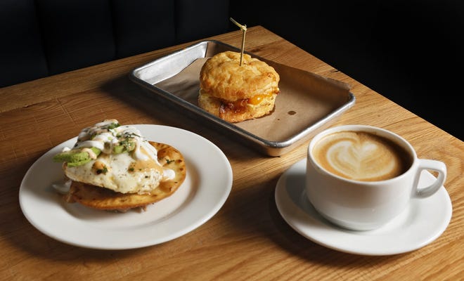 From left, the huevos rancheros, a breakfast sandwich and cappuccino at the Goat [Eric Albrecht/Dispatch]