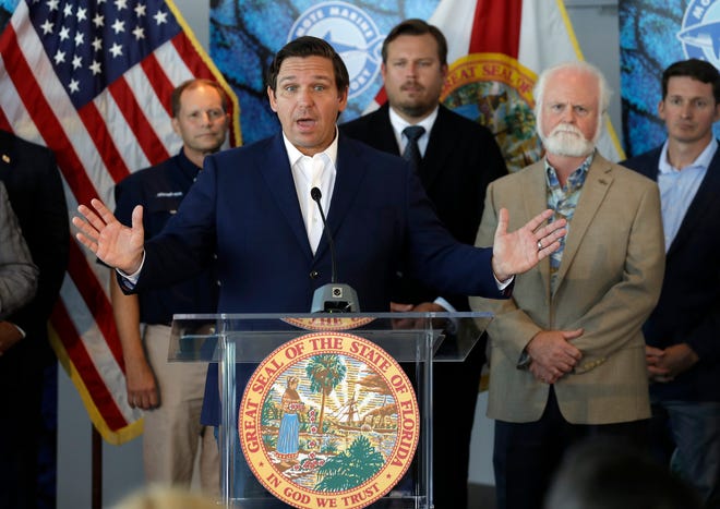 Gov. Ron DeSantis speaks after signing a red tide mitigation and technology development initiative into law during a news conference at Mote Marine Laboratory on Thursday in Sarasota. DeSantis says Florida will commit $3 million for the next five years for the purpose of prioritizing red tide prevention. [Chris O'Meara/The Associated Press]