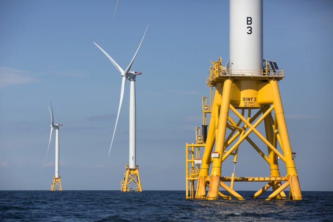 In this 2016 file photo, three of Deepwater Wind's five turbines stand in the water off Block Island, R.I., the nation's first offshore wind farm. [The Associated Press]