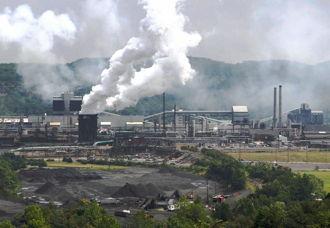 Smoke pours from the United States Steel Corp. Clairton Coke Works in Clairton, Pennsylvania. A fire at U.S. Steel’s massive coke plant outside Pittsburgh knocked a key pollution control system offline Monday, June 17, 2019. [Keith Srakocic/AP file]