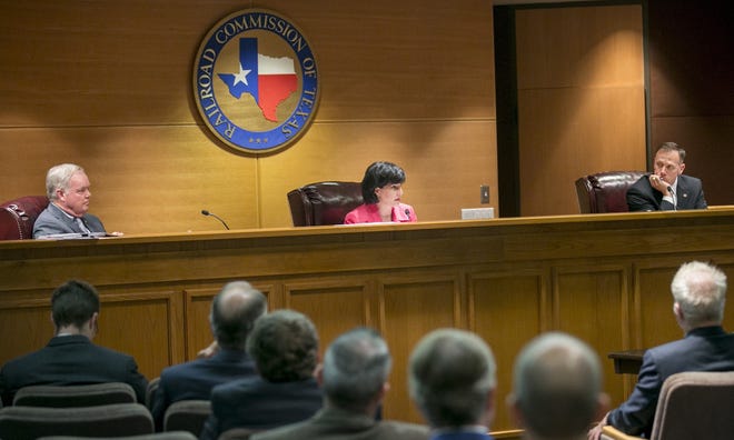 Commissioner Wayne Christian, from left, then-Chairwoman Christi Craddick and Commissioner Ryan Sitton of the Texas Railroad Commission at a May 2018 commission meeting. [JAY JANNER/AMERICAN-STATESMAN]