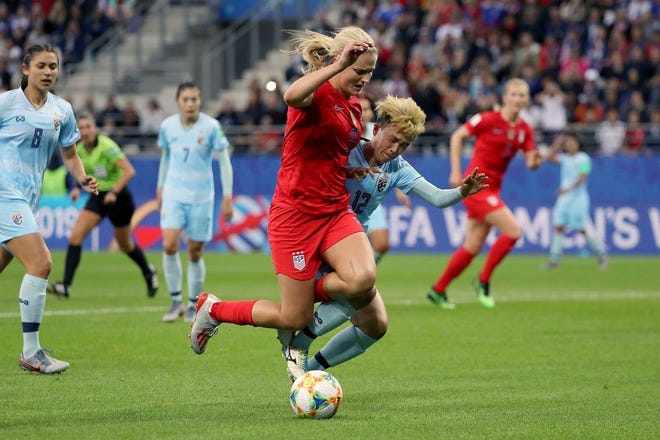 Lindsey Horan of the USA is challenged by Rattikan Thongsombut of Thailand inside the penalty area during the 2019 FIFA Women's World Cup France group F match between USA and Thailand at Stade Auguste Delaune on June 11, 2019 in Reims, France.