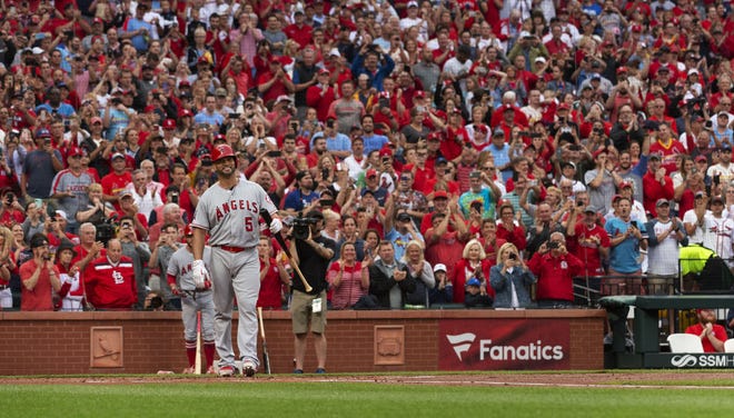 Los Angeles Angels' Albert Pujols (5) is greeted by a standing ovation before his first at-bat during the first inning a baseball game against the St. Louis Cardinals on Friday in St. Louis. [L.G. Patterson/The Associated Press]