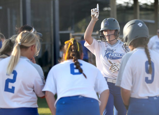 Arnold's Ashley Troutman celebrates a home run with teammates during a game last season. Troutman was named Miracle Sports 6A Player of the Year on Friday. [PATTI BLAKE/THE NEWS HERALD]