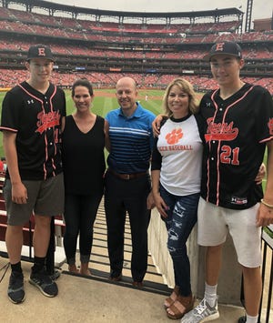 (Left to right): Matthew Boyer, Sara Boyer, Jeff Boyer, Nikki Schaefer and Grant Schaefer pose for a photo at Busch Stadium last Monday night in St. Louis before the Cardinals' game against the Miami Marlins. Matthew Boyer, Grant Schaefer and the rest of Edwardsville High School's baseball team was honored before the affair for winning the IHSA Class 4A state title. [SUBMITTED PHOTO]