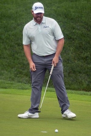 Zach Sucher grimaces after missing a putt for birdie on the 18th green during the second round of the Travelers Championship on Friday in Cromwell, Conn. [Patrick Raycraft /Hartford Courant via AP]