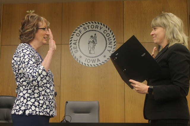 Lisa Heddens, a nine-term representative, was sworn in as a Story County Supervisor by Story County Attorney Jessica Reynolds on Tuesday. Photo by Robbie Sequeira