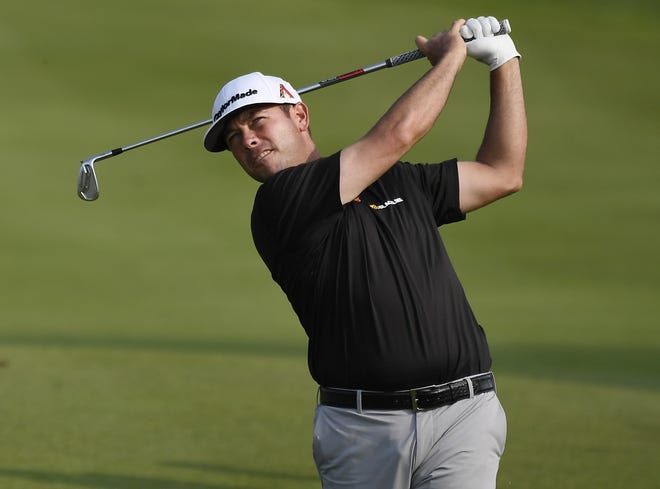 Chez Reavie hits his second shot on the 18th hole during the third round of the Travelers Championship Saturday, in Cromwell, Conn. [Jessica Hill/Associated Press]