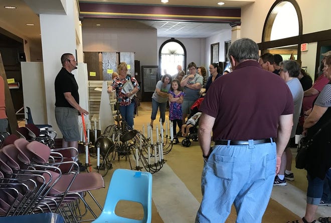 Submitted photo



People bid on items during an auction at the Tuscarawas County Public Library System's Main building Friday.