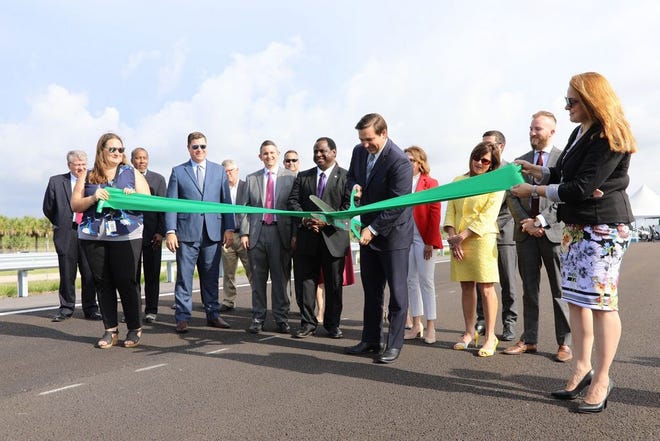 Gov. Ron DeSantis cuts the ceremonial ribbon opening the test track at SunTrax in Auburndale in June 2019.