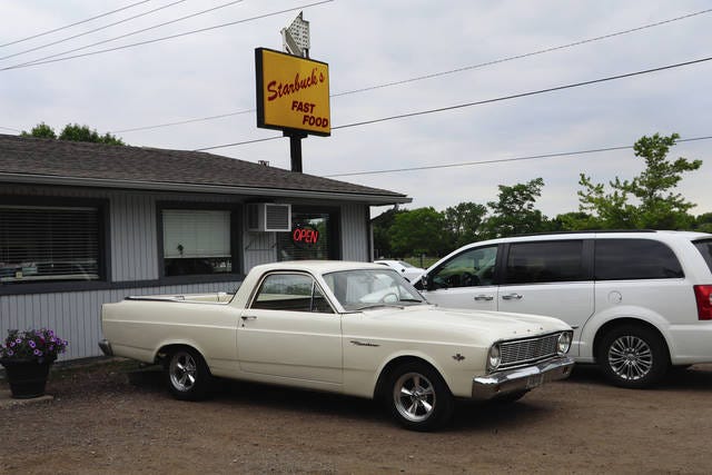 Shawn Clayberg, of Nevada and formerly of Story City, drove his vintage car, A 1966 Ford Ranchero, to Starbucks, and enjoyed talking to other owners of vintage cars who were there with the Iowa Street Association. Photo by Marlys Barker