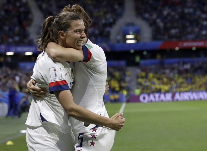United States' Tobin Heath, left, celebrates with her teammate Kelley O'Hara after scoring her team's second goal during the Women's World Cup Group F soccer match between Sweden and the United States at Stade Oceane, in Le Havre, France, on Thursday. The United States will face Spain on Monday to open the knockout round. [The Associated Press / Alessandra Tarantino]