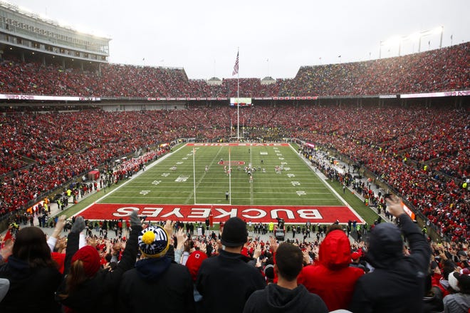 In this file photo fans cheer in the first half of the NCAA college football game between the Michigan Wolverines and the Ohio State Buckeyes at Ohio Stadium on Saturday, Nov. 24, 2018. [Photo by Tyler Schank]