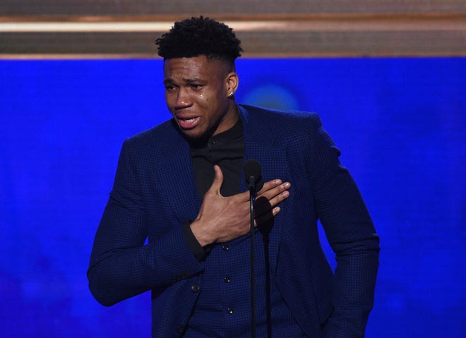 Giannis Antetokounmpo, of the Milwaukee Bucks, reacts as he accepts the most valuable player award at the NBA Awards. (Photo by Richard Shotwell/Invision/AP)