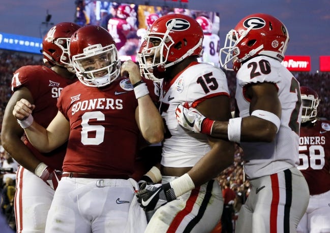 Oklahoma and Georgia played in the College Football Playoff national semifinal two years ago. The Sooners and Bulldogs agreed to a future home-and-home series earlier this year, part of a growing trend of programs beefing up non-conference schedules. Could it be a sign of playoff expansion? [NATE BILLINGS/THE OKLAHOMAN]