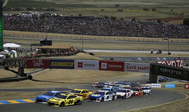 William Byron (24) leads the pack at the start of the NASCAR Cup Series race Sunday at Sonoma Raceway. Byron finished 19th but earned the fifth-most points in the event. [AP PHOTO/BEN MARGOT]
