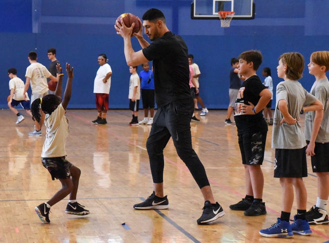Enes Kanter works with campers at the Hoop Du Jour Basketball & Training Camp at Faith United Church in Boynton Beach on Saturday morning. [JULIA BONAVITA/Special to The Post]