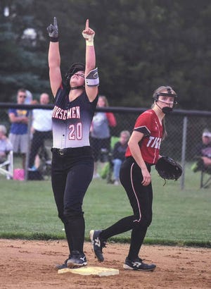 Roland-Story catcher Macy Friest points to the heavens after hitting a double in the fourth inning of the Norsemen’s 1-0 victory over Gilbert June 19 at the Hennessy Diamonds in Roland. The victory was Roland-Story’s fourth in five games.