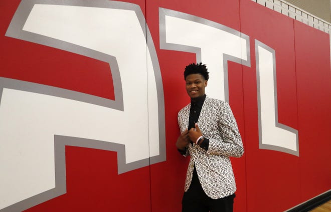 Atlanta Hawks first-round NBA draft pick Cam Reddish of Duke poses for a portrait after a news conference Monday, June 24, 2019, in Atlanta. (AP Photo/John Bazemore)