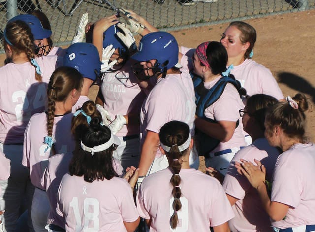 Ogden’s Denali Loecker is smothered in a sea of pink after hitting a lead-off home run in Tuesday’s game against Panorama. The Bulldogs hosted a “Pink Out” in order to raise donations for Humboldt senior Ashlyn Clark, who was recently diagnosed with Non-Hodgkin lymphoma. Admission was free with donations collected at the gate. Ogden went on to win 5-2. Photo by Andrew Logue/News-Republican