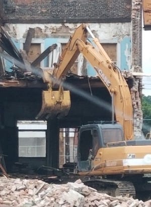 Demolition begins on the historic Kingston Hotel in Canaseraga on Friday. [READER SUBMITTED PHOTOS]