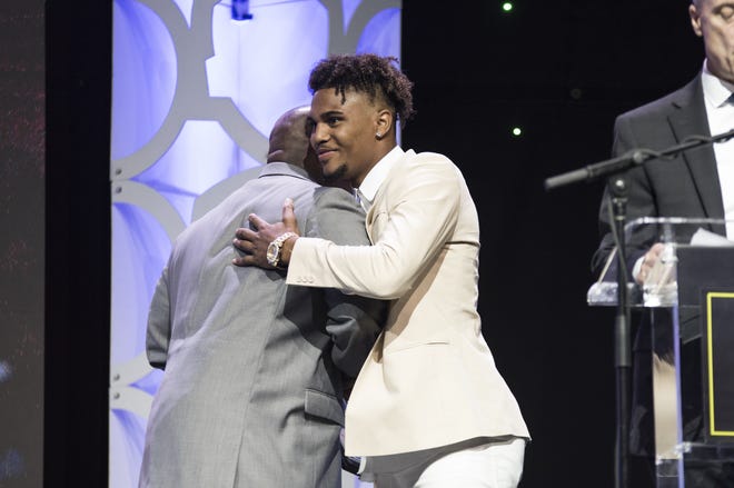 Major Dedmond of Freeport High School receives the Rockford Park District Boys Athlete of the Year award from Lamont Jones of the park district at the 2019 All Star Preps Best of Rock River Valley banquet on Tuesday, June 25, 2019, at the BMO Harris Bank Center in downtown Rockford. [RACHAEL KEATING/RRSTAR.COM & THE JOURNAL-STANDARD CORRESPONDENT]
