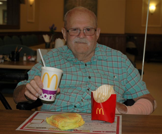 Walnut Hills Nursing Home recently celebrated National Nursing Home Week with a theme of “What Brings a Smile.” Pictured: Walnut Hills resident Jay Rhodes takes part in a meal delivered by McDonald’s as part of the festivities. PHOTO PROVIDED