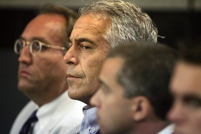 FILE- In this July 30, 2008 file photo, Jeffrey Epstein is shown in custody in West Palm Beach, Fla. Labor Secretary nominee Alexander Acosta is expected to face questions at his Senate confirmation hearing about an unusual plea deal he oversaw for Epstein, a Florida billionaire and sex offender, as U.S. attorney in Miami. Federal prosecutors say a once-secret plea deal reached over a decade ago with Epstein must stand, despite objections from many of his victims. Prosecutors said in a new court filing that a violation of the Crime Victims’ Rights Act does not allow for the agreement to be voided. (Uma Sanghvi/Palm Beach Post via AP)