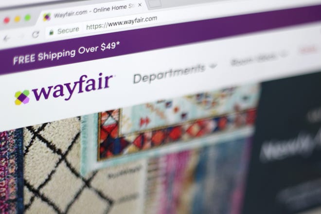 FILE- This April 17, 2018, file photo shows the Wayfair website on a computer in New York. Employees at online home furnishings retailer Wayfair have planned a walkout to protest the company's decision to sell $200,000 worth of furniture to a government contractor that runs a detention center for migrant children in Texas. (AP Photo/Jenny Kane, File)