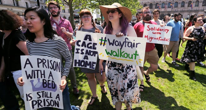 Employees of Wayfair march to Copley Square in protest prior to their rally in Boston, Wednesday, June 26, 2019. [AP Photo/Charles Krupa]