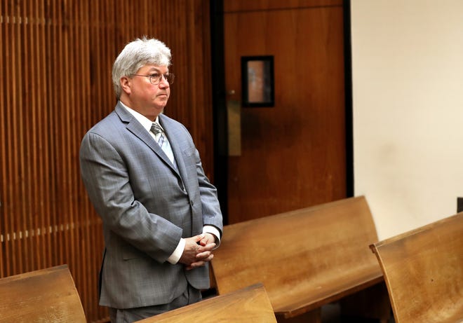 Sen. Michael Brady waited to appear in Quincy District Court on June 4. [Pool photo/David L. Ryan/Boston Globe]