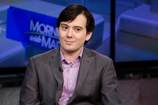 FILE - In this Aug. 15, 2017 file photo, Martin Shkreli is interviewed by Maria Bartiromo during her "Mornings with Maria Bartiromo" program on the Fox Business Network, in New York. A federal appeals court in New York City is considering whether the securities fraud conviction against Shkreli, the former drug company executive known as “Pharma Bro” should be thrown out. An attorney Shkreli urged the court to overturn a 2017 guilty verdict for Shkreli, claiming the trial judge gave confusing instructions to the jury about the law. A prosecutor insisted the instructions were proper. (AP Photo/Richard Drew, File)