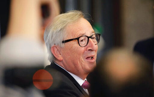 European Commission President Jean-Claude Juncker speaks with the media as he leaves an EU summit in Brussels, Friday, June 21, 2019. EU leaders concluded a two-day summit on Friday in which they discussed, among other issues, the euro-area. (AP Photo/Olivier Matthys)