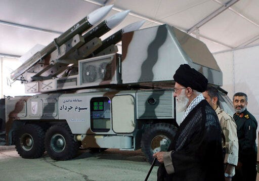 In this photo released on May 11, 2014, by an official website of the office of the Iranian supreme leader, Third of Khordad air defense system is displayed while Supreme Leader Ayatollah Ali Khamenei visits an exhibition of achievements of Revolutionary Guard's aerospace division, in Iran. Iran's Revolutionary Guard shot down a U.S. surveillance drone Thursday, June 20, 2019, in the Strait of Hormuz, marking the first time the Islamic Republic directly attacked the American military amid tensions over Tehran's unraveling nuclear deal with world powers. Iran said it has used its air defense system known as Third of Khordad to shoot down the drone — a truck-based missile system that can fire up to 18 miles (30 kilometers) into the sky. (Office of the Iranian Supreme Leader via AP)