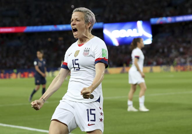 United States' Megan Rapinoe celebrates after scoring her side's second goal during the Women's World Cup quarterfinal soccer match between France and the United States at the Parc des Princes in Paris on Friday. [Francisco Seco/The Associated Press]