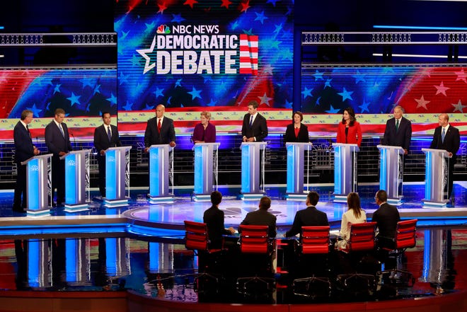 Democratic presidential candidate and former Housing and Urban Development Secretary Julian Castro, third from left, answers a question during a Democratic primary debate hosted by NBC News at the Adrienne Arsht Center for the Performing Art on Thursday, June 27, 2019, in Miami. [Wilfredo Lee/AP]