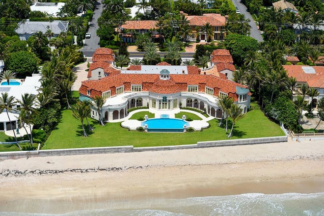 Viewed from above the beach, a never-lived-in Palm Beach mansion completed in 2016 and priced at nearly $60 million is under contract at 1071 N. Ocean Blvd, according to an updated listing in the local multiple listing service. [Photo by Andy Frame, courtesy Douglas Elliman Real Estate]