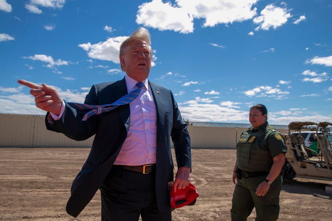 FILE - In this Friday, April 5, 2019 file photo, President Donald Trump speaks as he visits a new section of the border wall with Mexico in Calexico, Calif. A federal judge on Friday, June 28, prohibited Trump from tapping $2.5 billion in military funding to build high-priority segments of his prized border wall in California, Arizona and New Mexico. Judge Haywood S. Gilliam, Jr. in Oakland acted in two lawsuits filed by California and by activists who contended that the money transfer was unlawful and that building the wall would pose environmental threats.(AP Photo/Jacquelyn Martin, File)