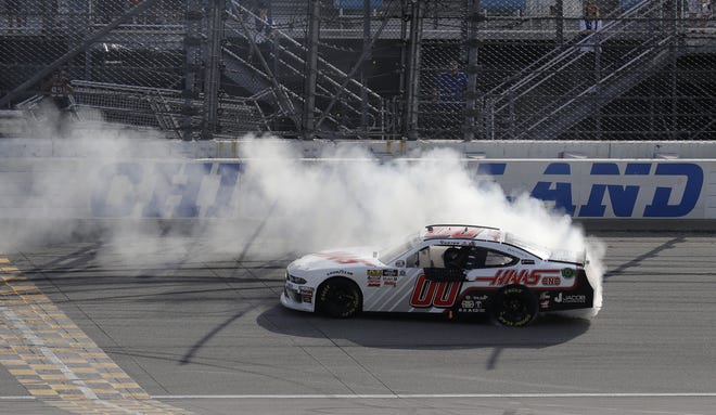 Cole Custer does a burnout after winning the NASCAR Xfinity Series race at Chicagoland Speedway in Joliet on Saturday. [NAM Y. HUH/THE ASSOCIATED PRESS]