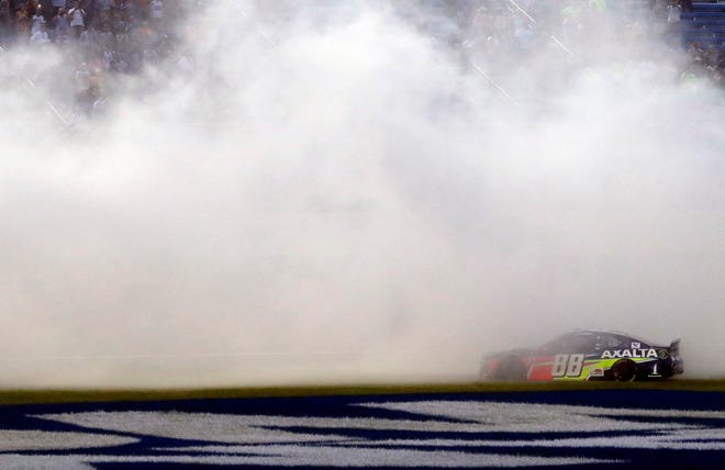 Alex Bowman does a burnout Sunday night after winning the Monster Energy NASCAR Cup Series' Camping World 400 at Chicagoland Speedway in Joliet, Ill. It is Bowman's first Cup Series victory. [The Associated Press / Nam Y. Huh]
