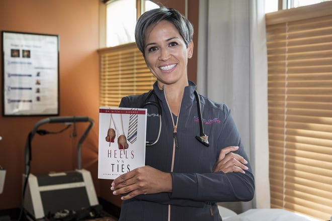 Dr. Nitza Alvarez published her first book, "Heels vs Ties," to spread awareness of the differences between men and women when it comes to heart disease — the No. 1 threat to women. [Cindy Sharp/Correspondent]