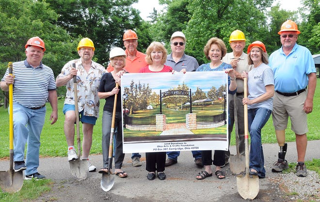 Taking part in the groundbreaking for the new entrance for the Salt Fork Arts and Crafts Festival archway in Cambridge City Park are, from left, Dave Conrath, Bob Jones, Mary Ann DeVolld, Mike Edwards, Brenda Taylor, Russ Ables, Carol Wilcox Jones, Bob Jennings, Lori Warne and Bill Cowgill.
