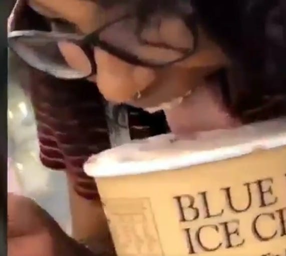 A viral video shows a woman licking a tub of Blue Bell ice cream and then putting it back in a store freezer. [TWITTER]