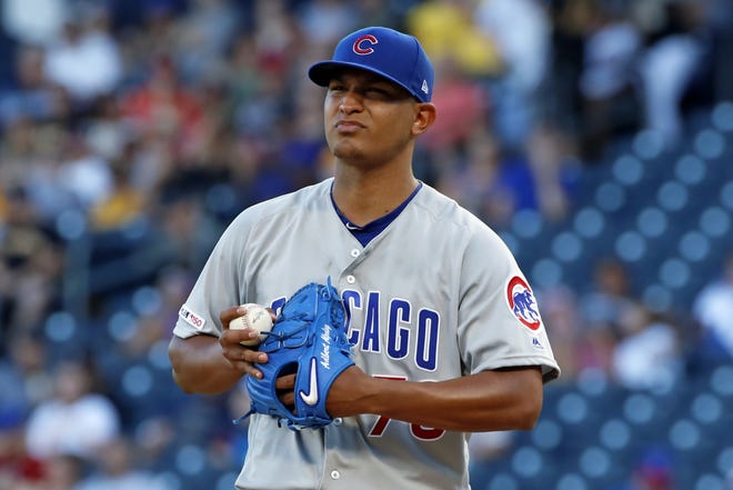 Chicago Cubs starting pitcher Adbert Alzolay collects himself after giving up a three-run home run to Pittsburgh Pirates' Josh Bell during the first inning in Pittsburgh, Monday. [GENE J. PUSKAR/THE ASSOCIATED PRESS]