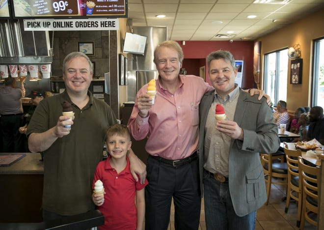 Robert Mayfield, second from right, with his sons Linton Mayfield, left, and Nathaniel Mayfield and his grandson, Alex Mayfield, at their Dairy Queen restaurant in Round Rock. [JAY JANNER/AMERICAN-STATESMAN]